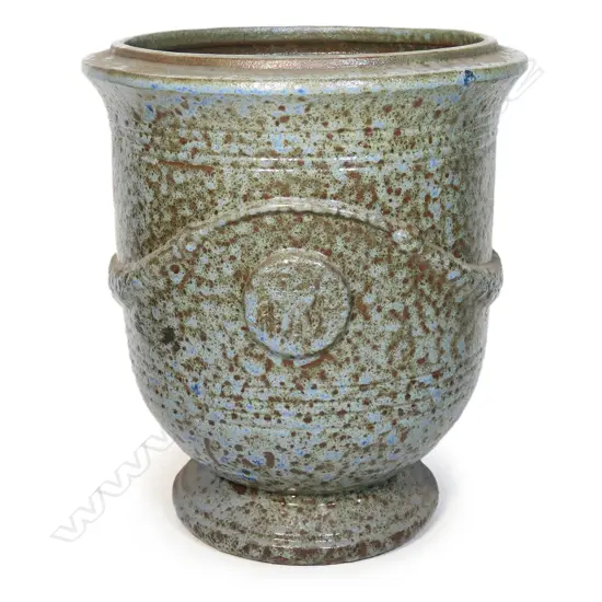 A large Versailles pedestal urn, coral blue mottled glaze, relief swags and 'Versailles' panels. H.750mm. Dia.650mm