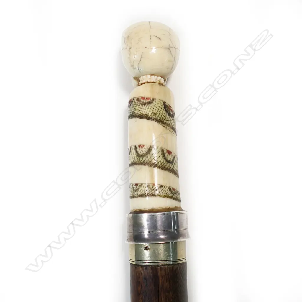 A 20thC marine ivory and scrimshaw handled sword walking stick, Image 1++