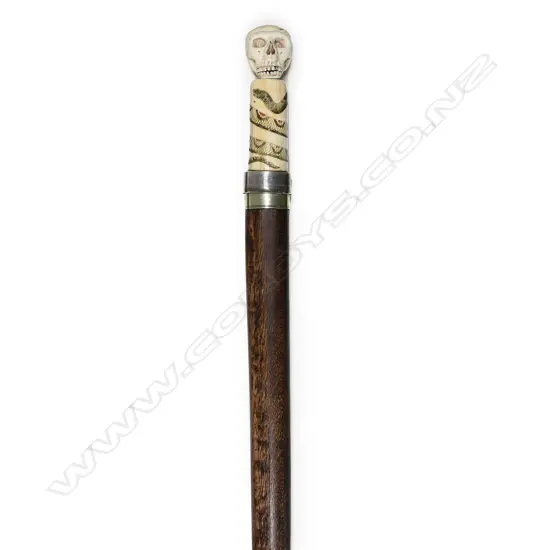 A 20thC marine ivory and scrimshaw handled sword walking stick,