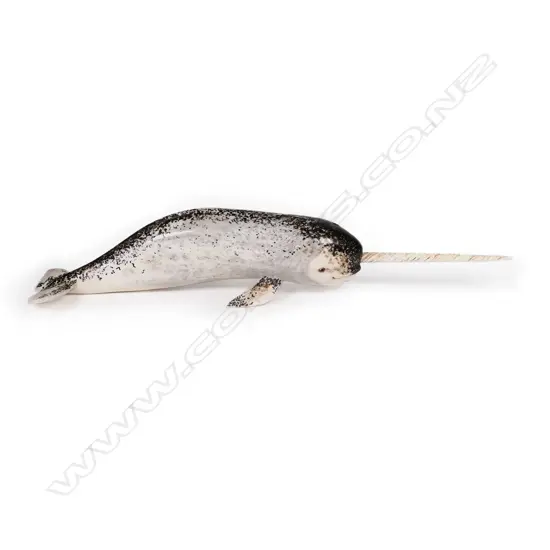 Des Baker carved whale bone sculpture of a narwhal,