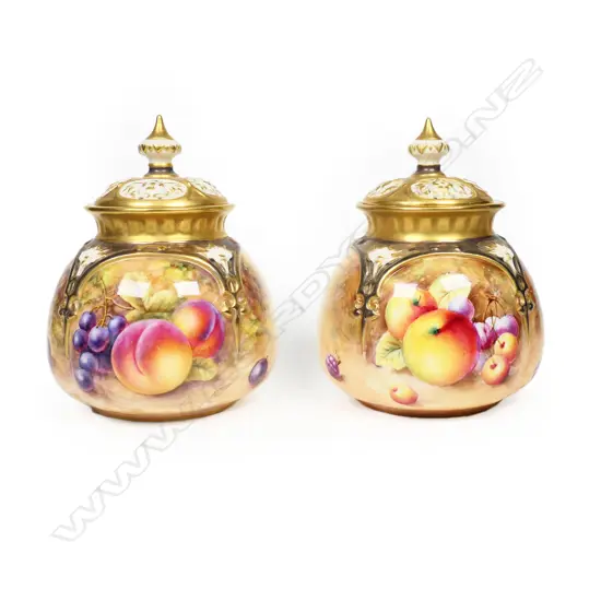 A pair of Royal Worcester lidded potpourri urns,