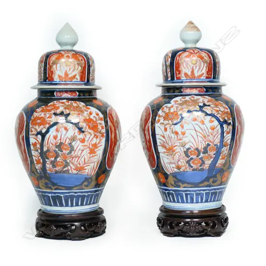 A pair of c.1900 hand-painted Imari lidded vases,