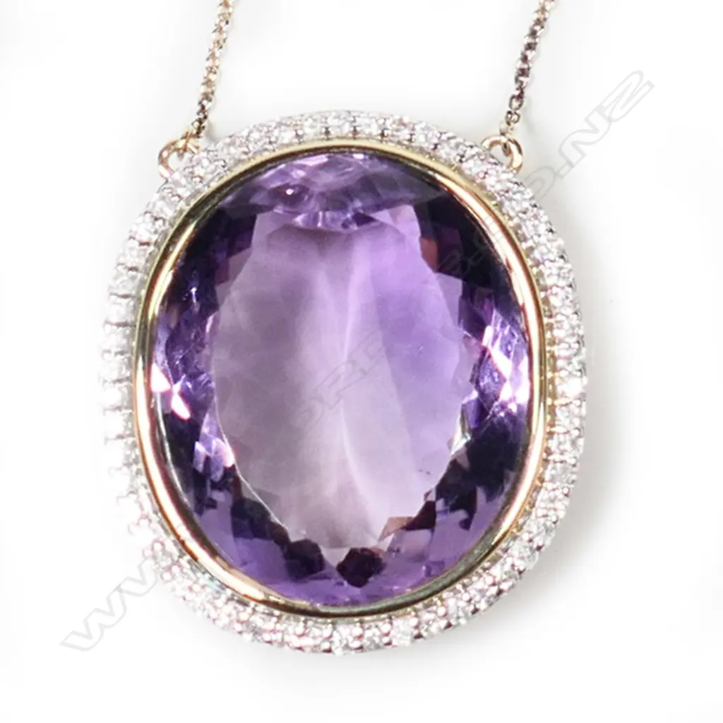 A 10ct gold amethyst and diamond necklace, Image 1++