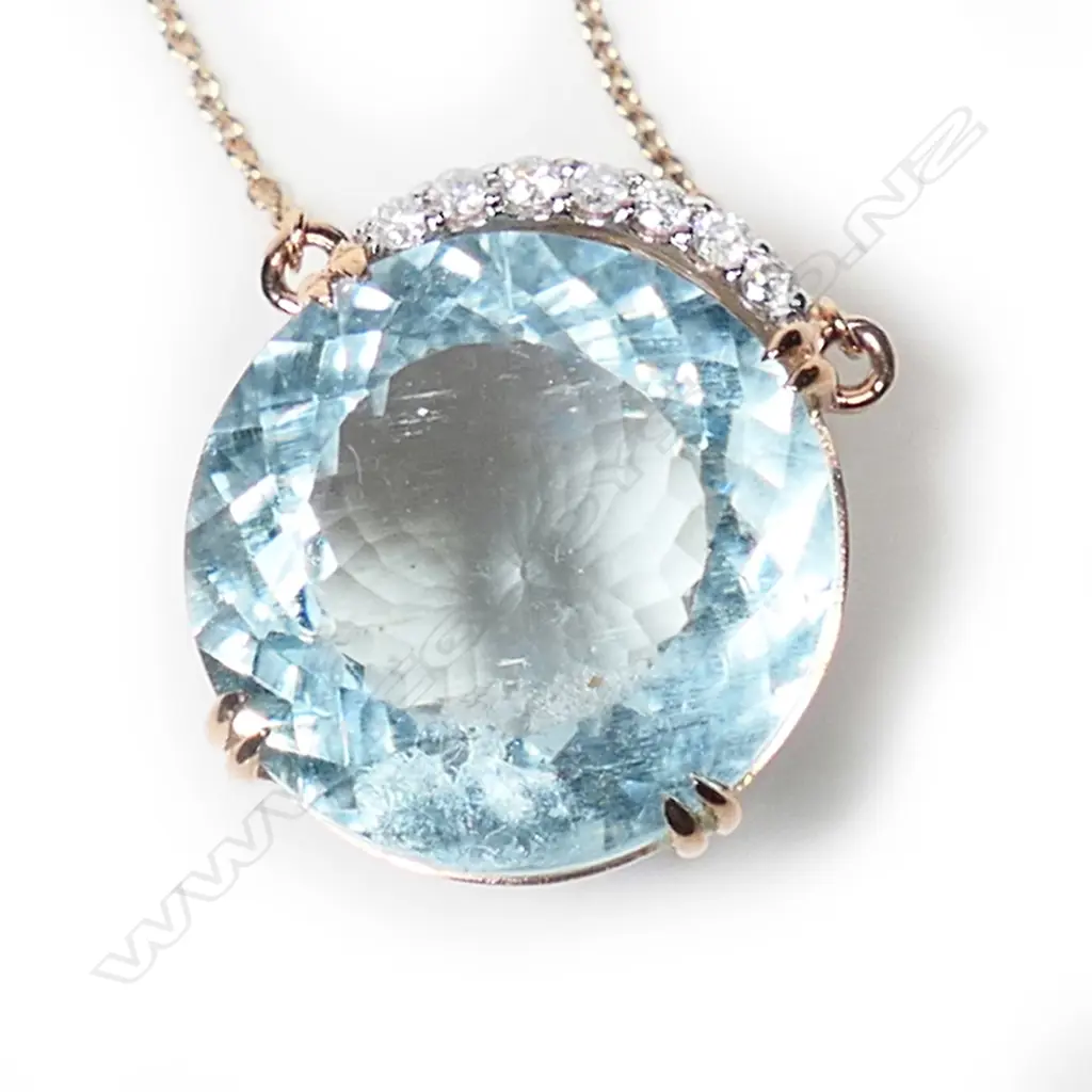 A 14ct rose gold aquamarine and diamond necklace, Image 1++