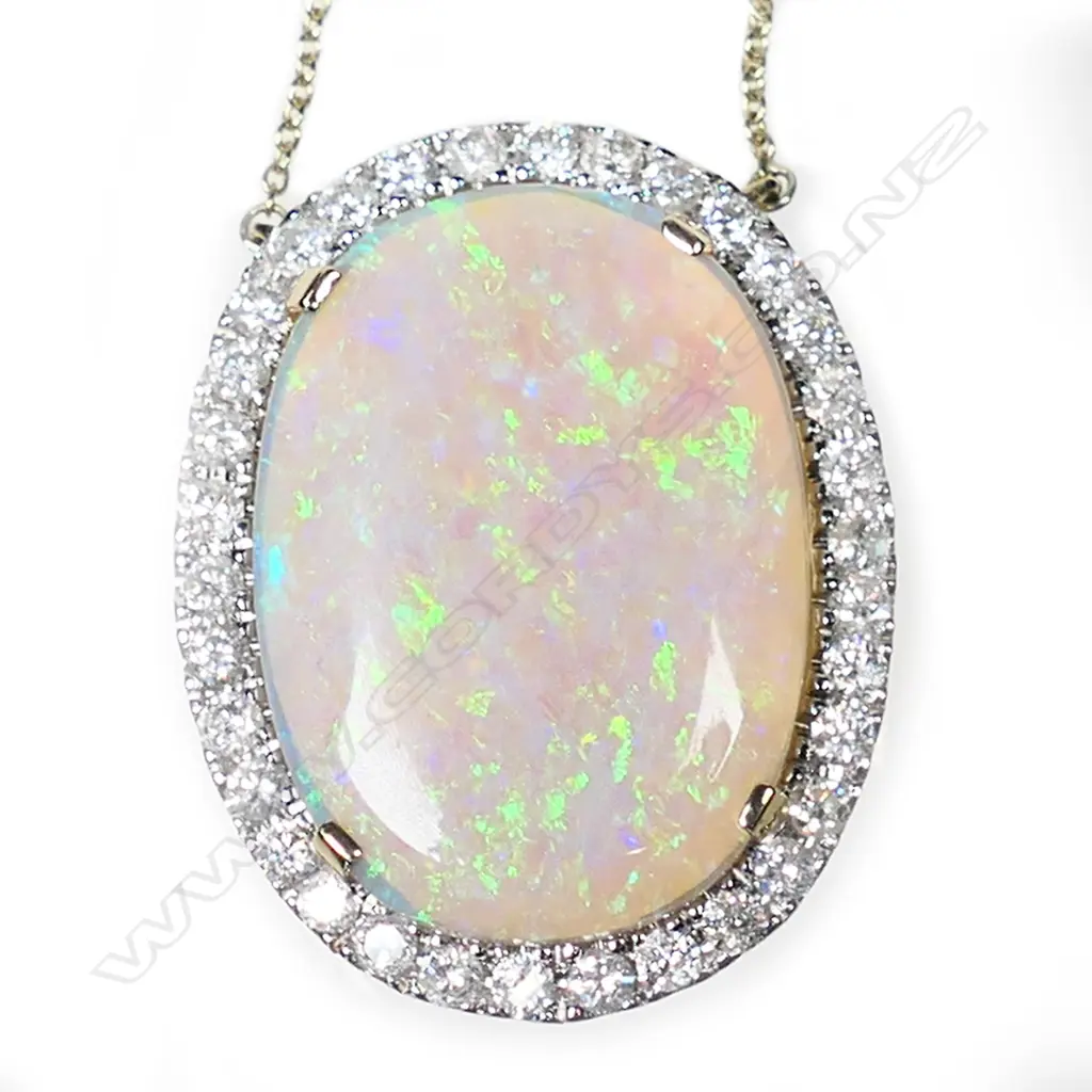 A 14ct gold opal and diamond halo necklace, Image 1++