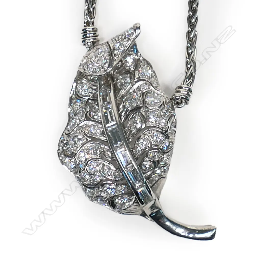 A platinum and diamond pendant on chain, Image 1++
