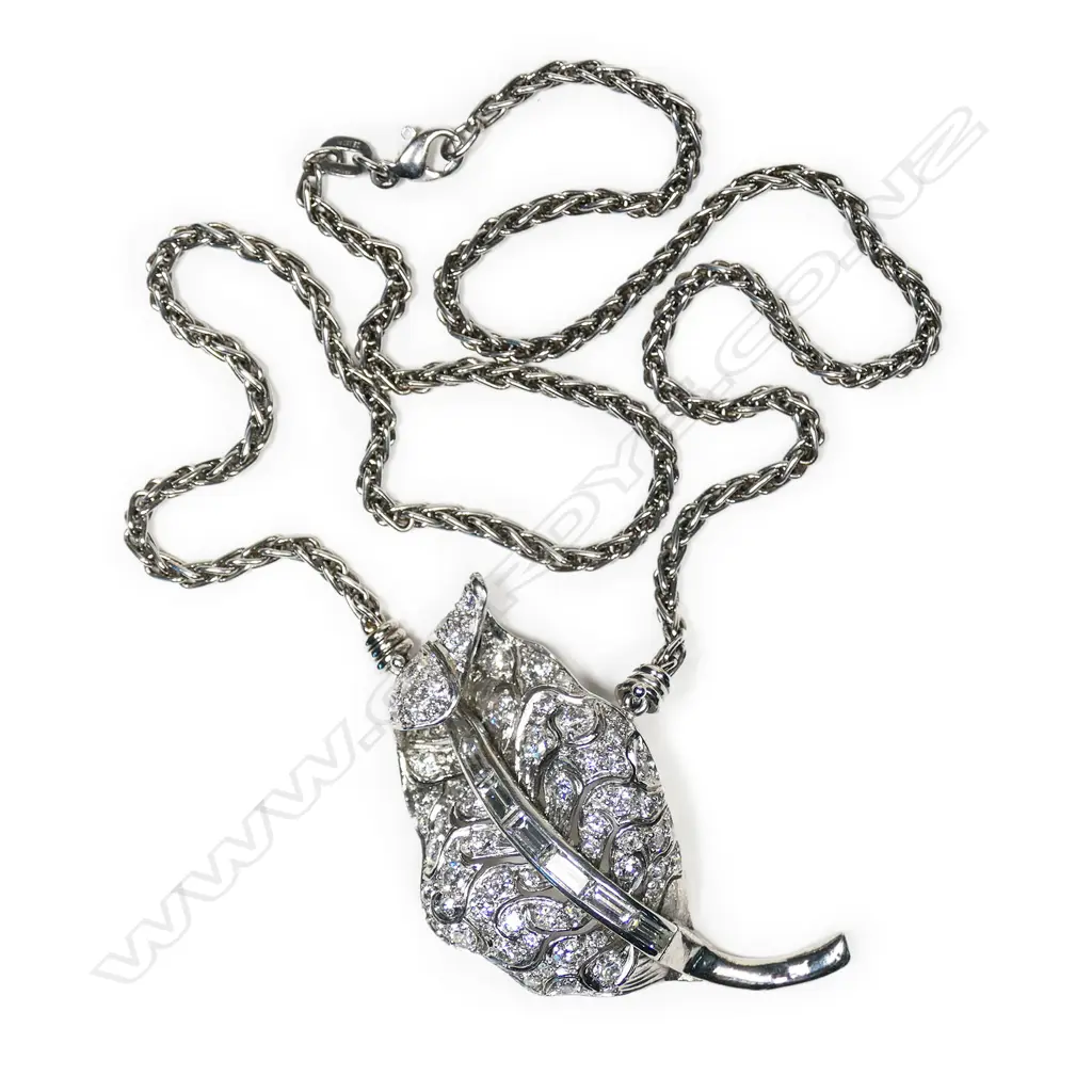 A platinum and diamond pendant on chain, Image 1++