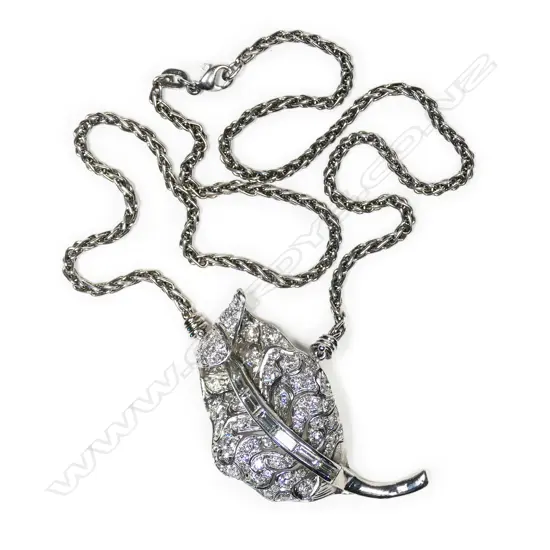 A platinum and diamond pendant on chain,