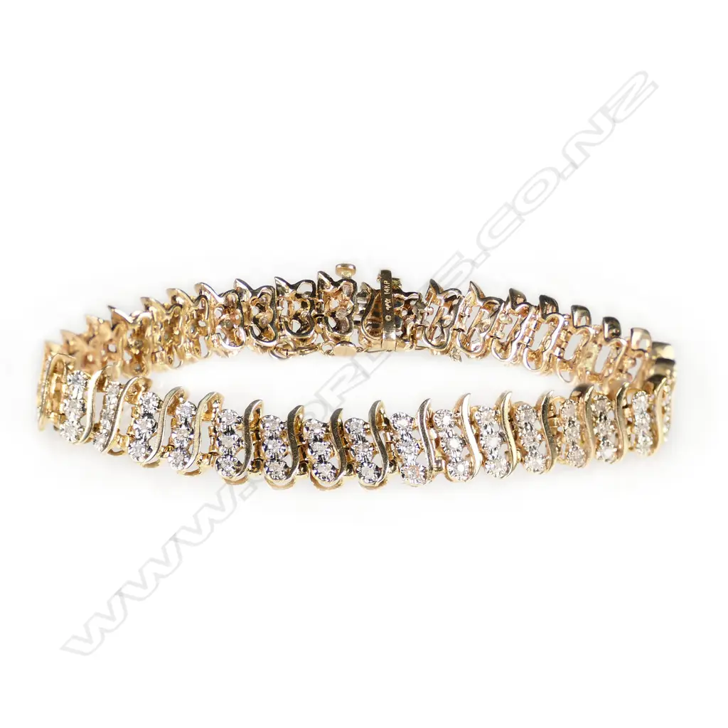 A 14ct yellow gold and diamond bracelet, Image 1++