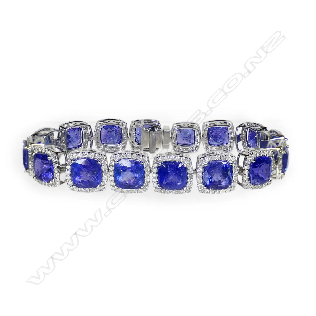 A 14ct white gold tanzanite and diamond halo bracelet, Image 1++