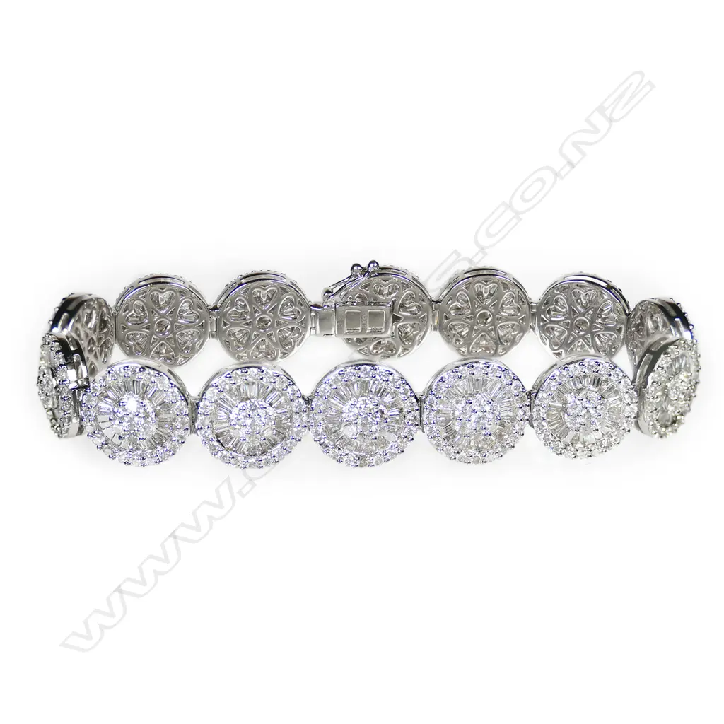 An 18ct white gold and diamond cluster bracelet, Image 1++