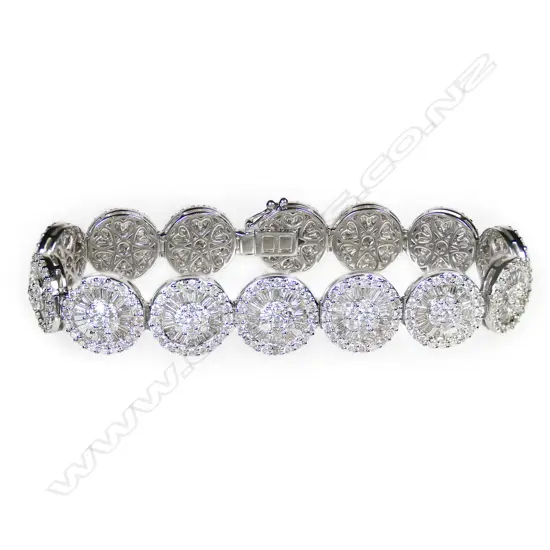 An 18ct white gold and diamond cluster bracelet,