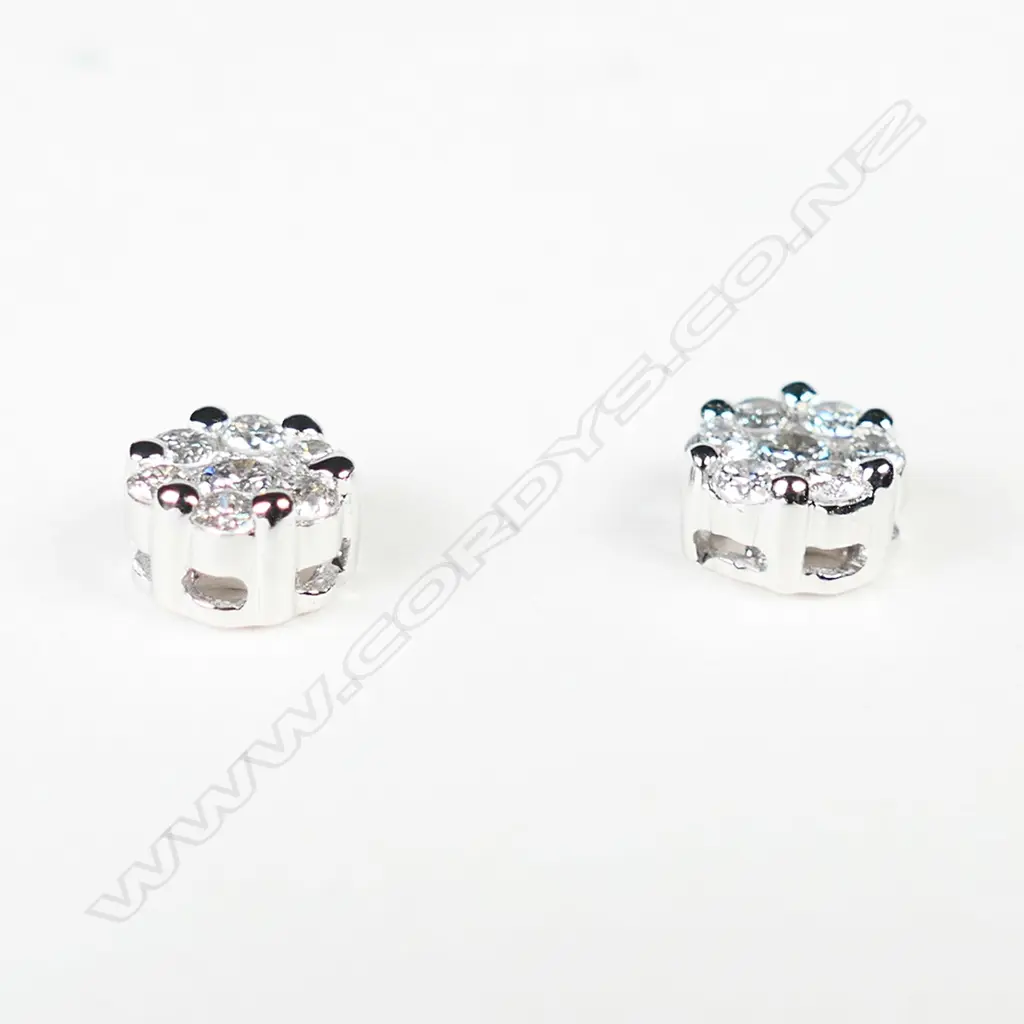 A pair of 18ct white gold diamond cluster earrings, Image 1++
