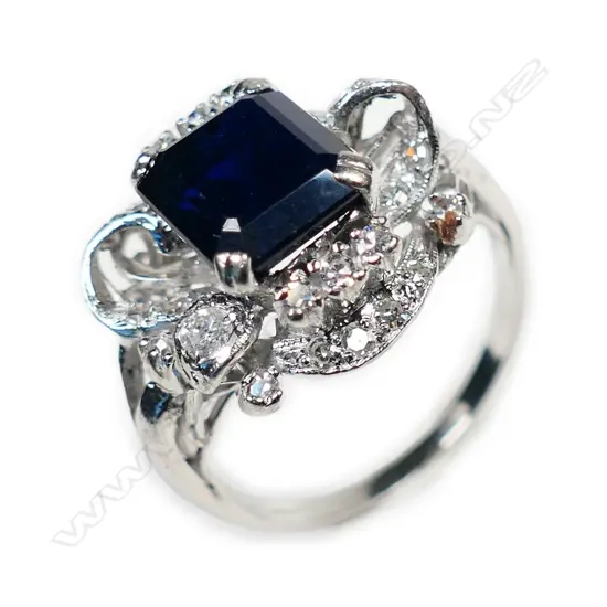 A vintage 14ct white gold sapphire and diamond cluster ring,