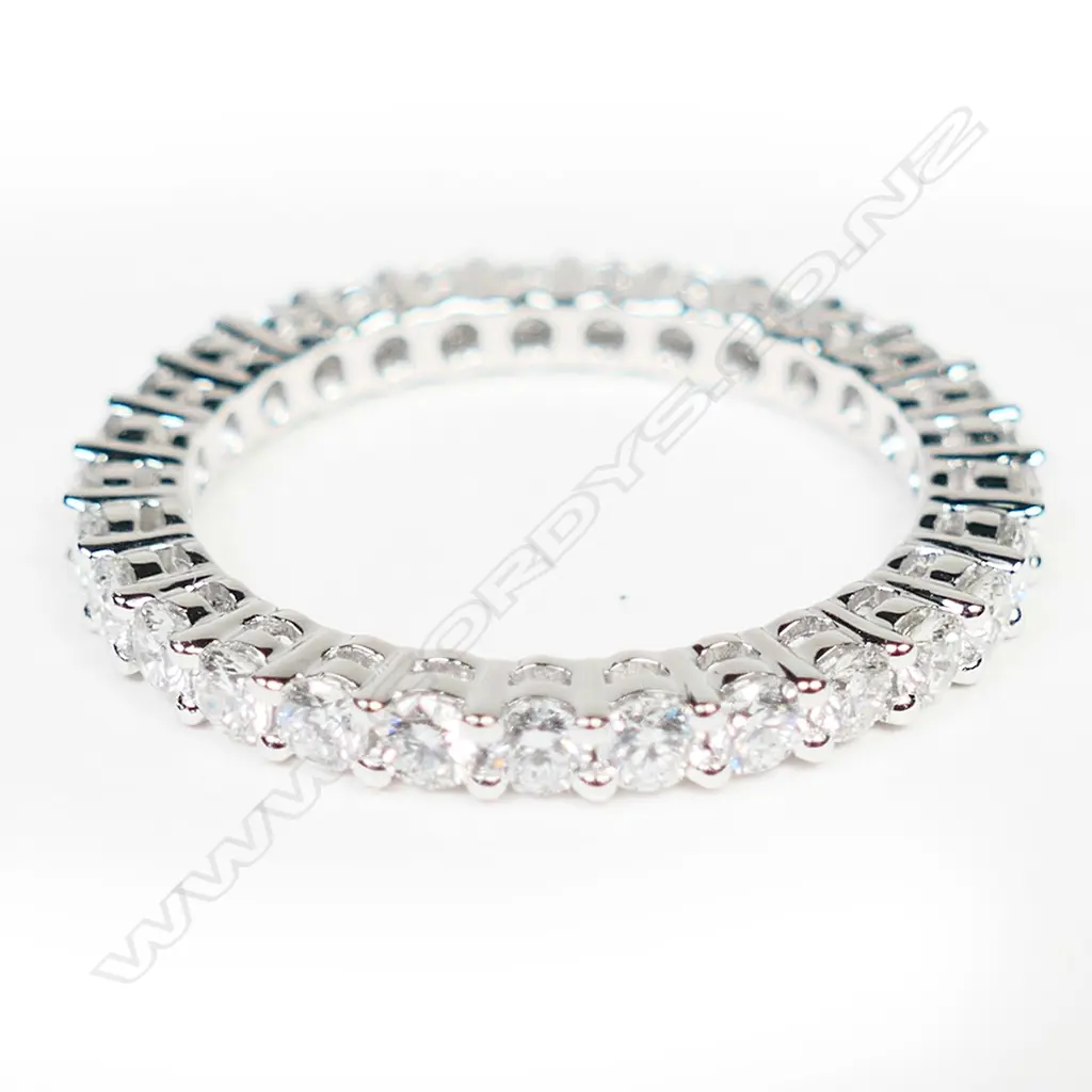 A platinum and diamond eternity band ring, Image 1++