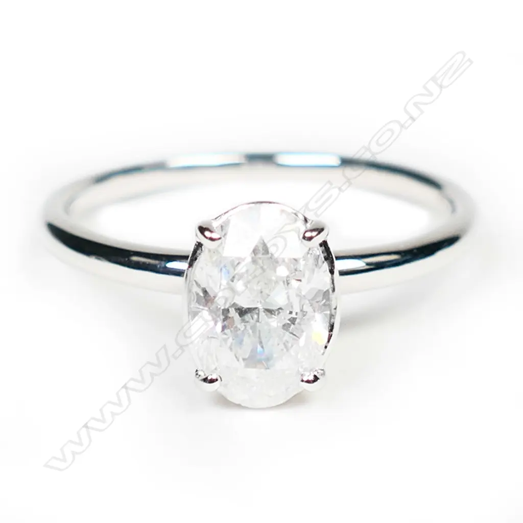 A 14ct white gold and diamond solitaire ring, Image 1++