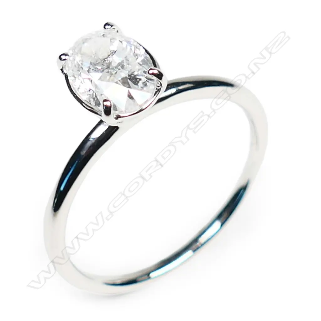 A 14ct white gold and diamond solitaire ring, Image 1++