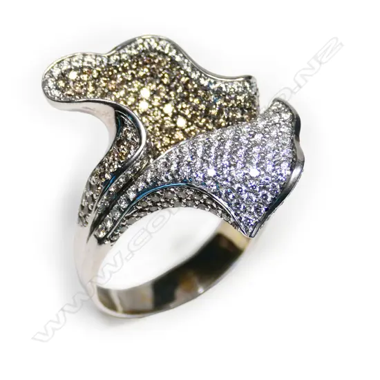 A 18ct white gold and multiple diamond floral design pavé set ring,