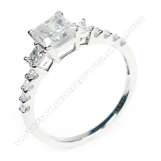 A 14ct white gold and diamond trilogy ring,
