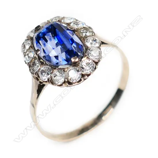 A traditional estate gold and sapphire cluster ring,