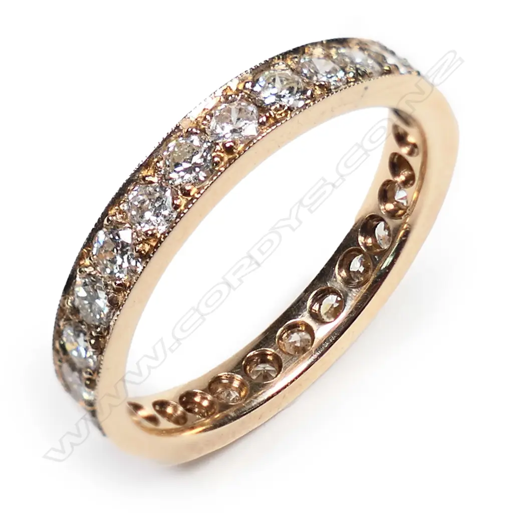 An 18ct rose gold and diamond set band, Image 1++
