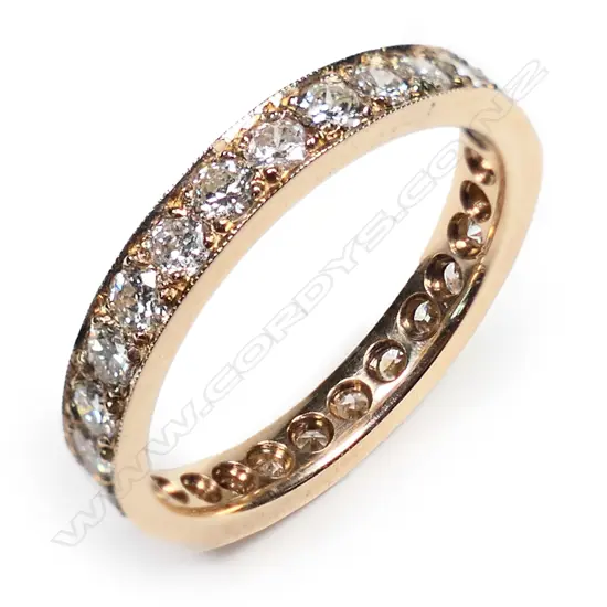 An 18ct rose gold and diamond set band,
