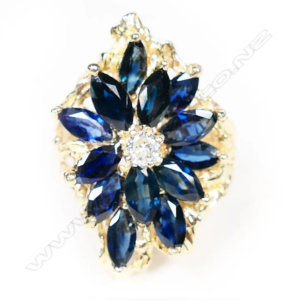 A 14ct gold sapphire and diamond cluster ring, Image 1++
