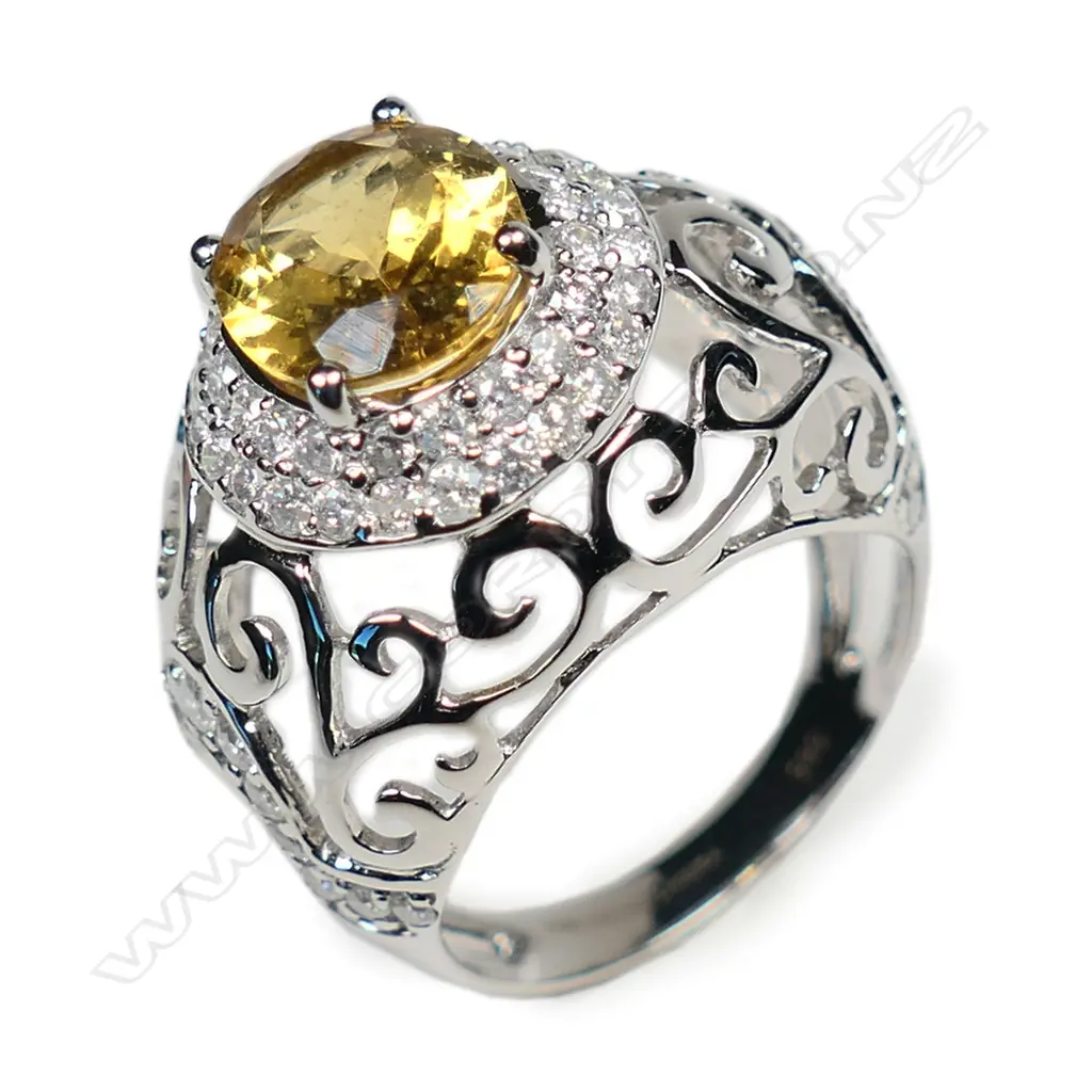 A 14ct white gold heliodor and diamond halo ring, Image 1++