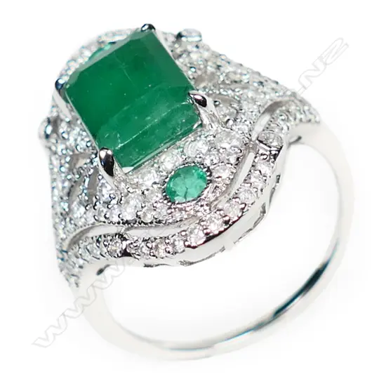 A 14ct white gold emerald and diamond Art Deco style ring,