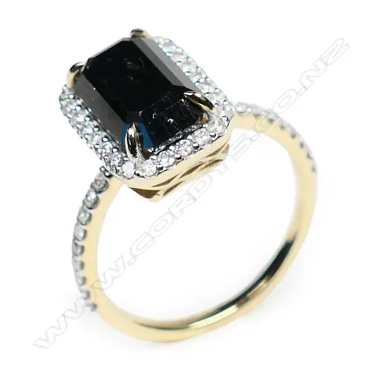 A 14ct gold and black diamond halo ring