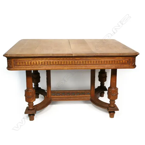 A  c.1900 French style oak extension dining table,