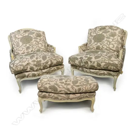 A pair of  Designers Guild French style bergère armchairs with one matching stool,