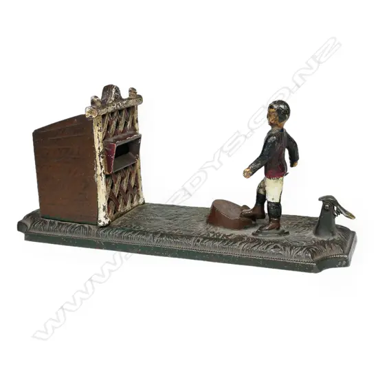 A Vintage cast iron football player money bank,