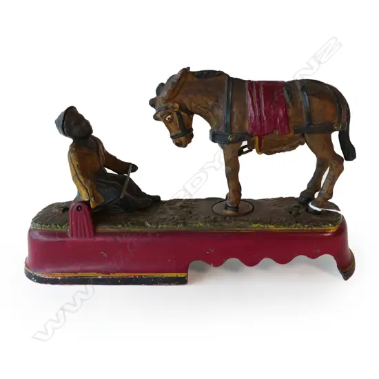 An 1897 US cast iron mechanical bank 'I Always Did 'Spise a Mule',