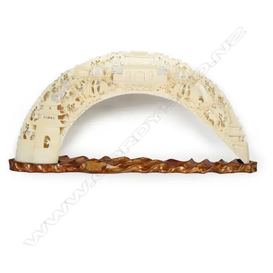 Extensively carved hippopotamus tusk,