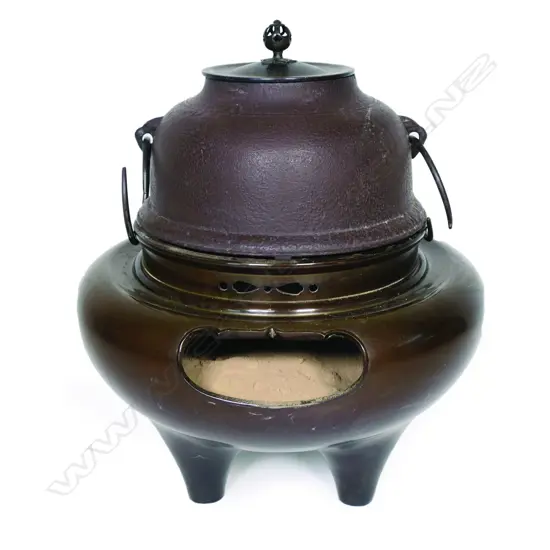 An old Japanese bronze and iron fire hearth and kettle,