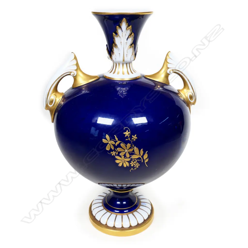 A hand-painted Royal Worcester vase by Harry Davis. The vignette of a lake with a castle in the foreground. Swollen shape with flared opening and gilt highlights. With registration number date for 1902. H.230mm. Image 1++