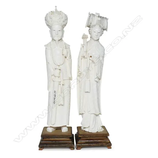 A Chinese Emperor and Empress solid ivory carved figures,