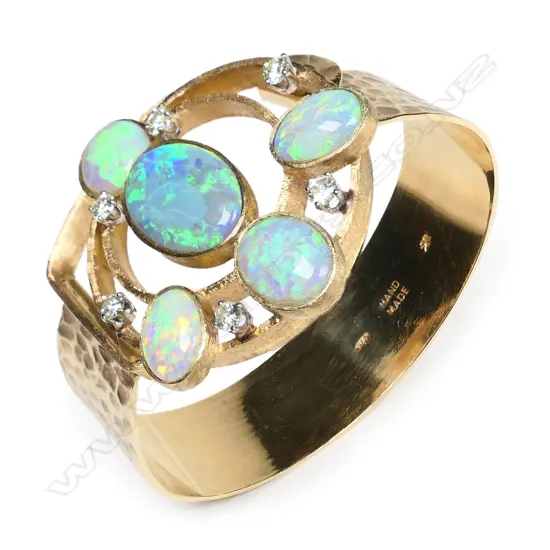An impressive 'handmade' contemporary 14ct yellow gold opal and diamond designer bangle,