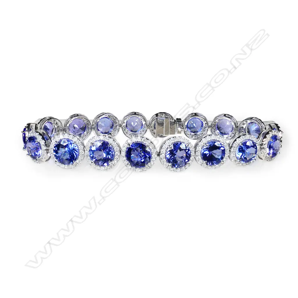 A 14ct white gold tanzanite and diamond halo bracelet, Image 1++