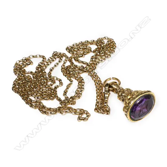 An antique 15ct yellow gold muff chain with 15ct fancy fob seal,