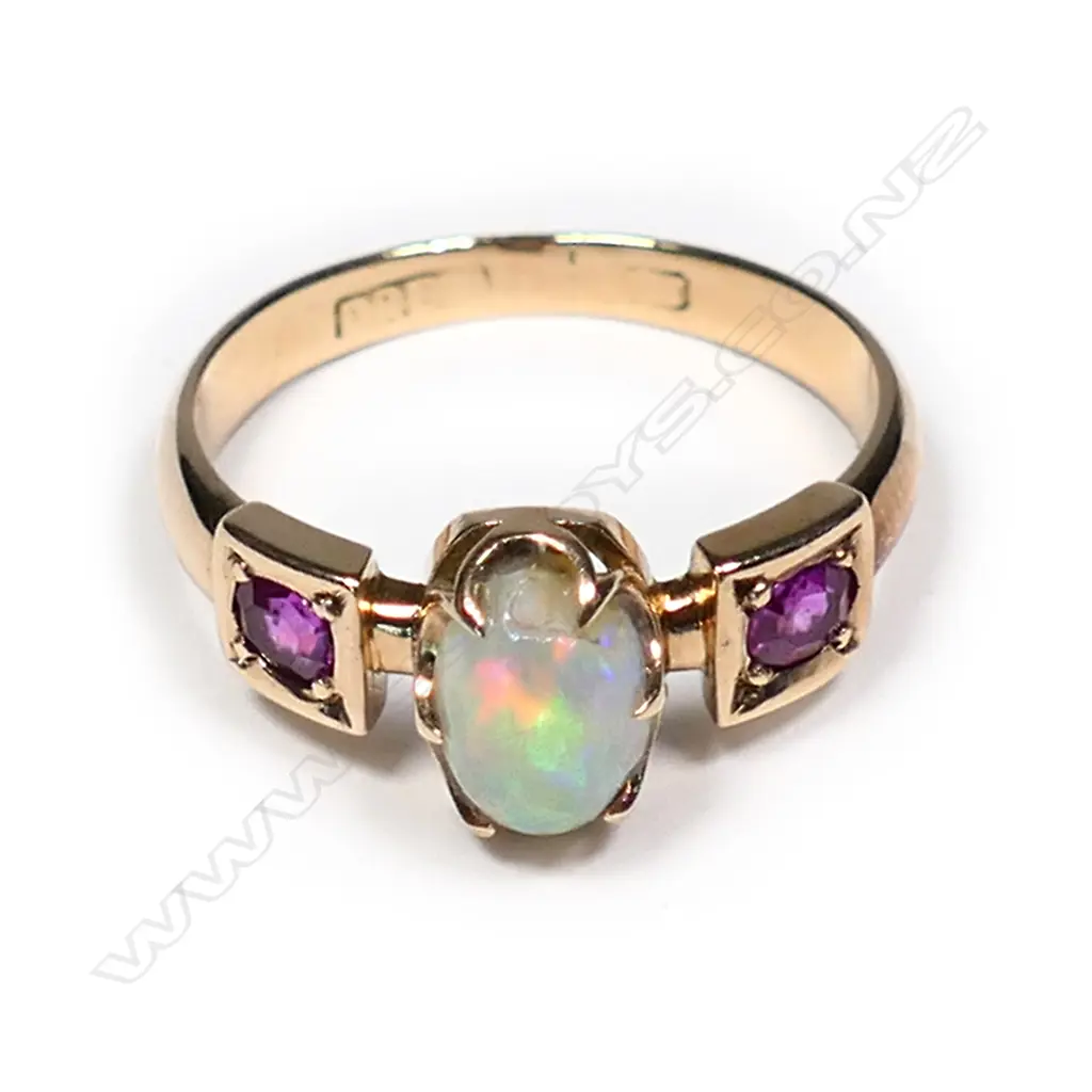 An 18ct ruby and opal ring Image 1++