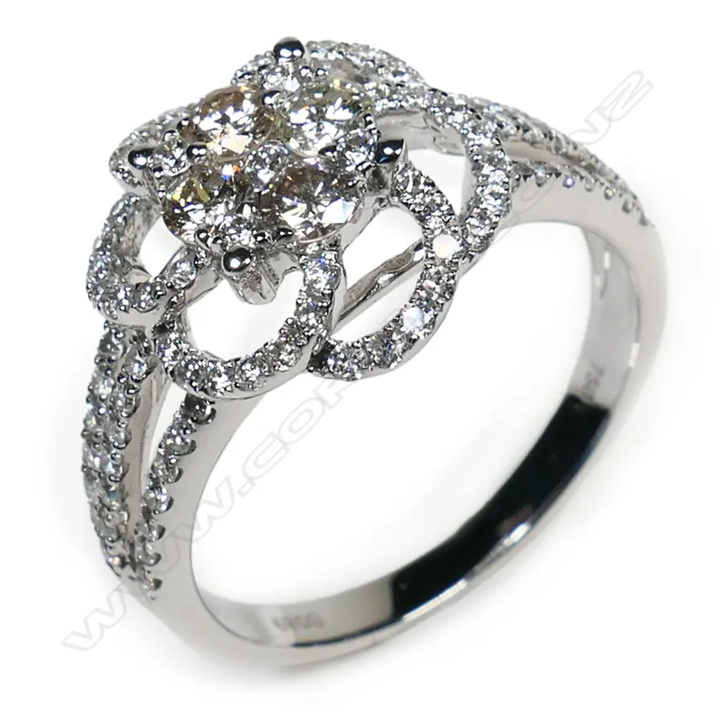 An 18ct white gold diamond cluster ring, Image 1++