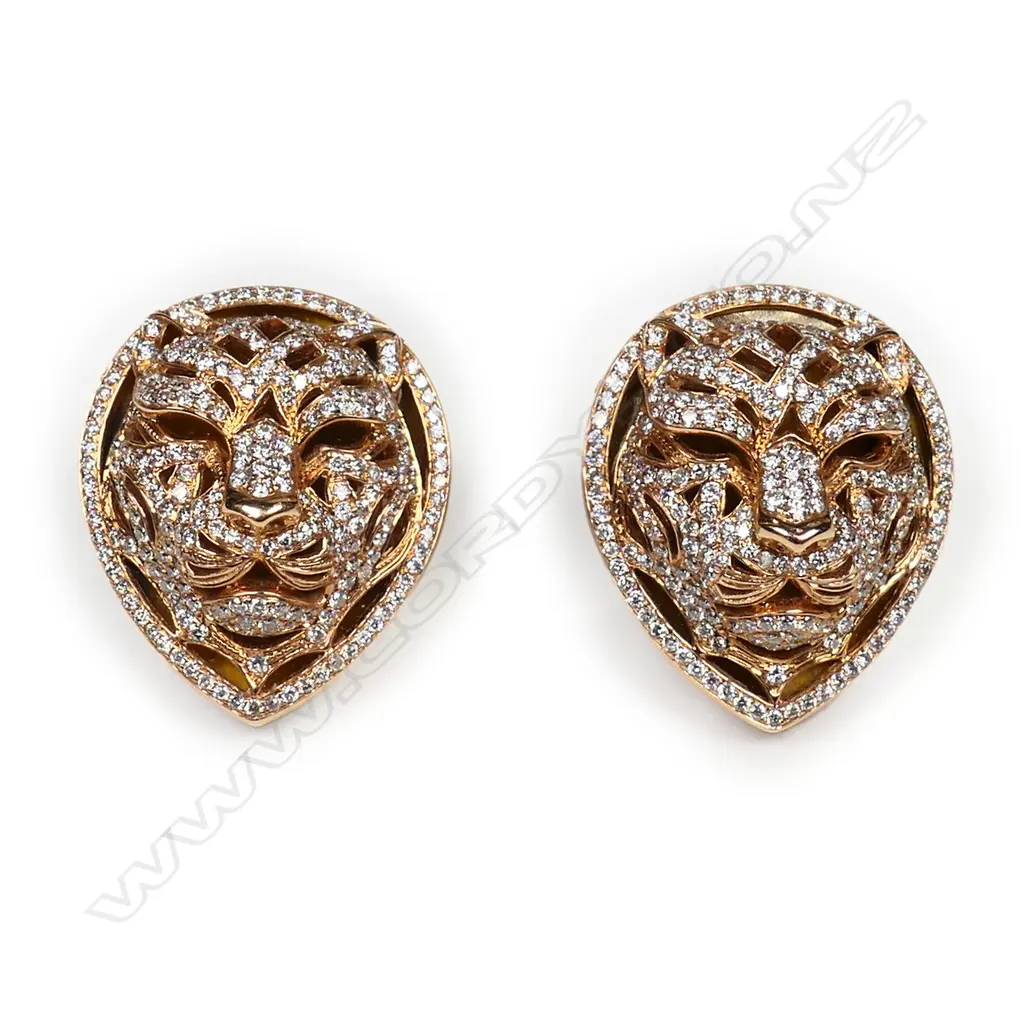 A pair of 18ct rose gold and diamond lion mask earrings, Image 1++