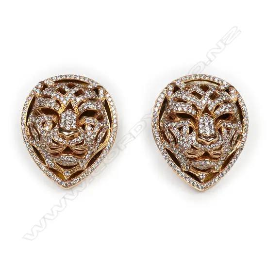 A pair of 18ct rose gold and diamond lion mask earrings,