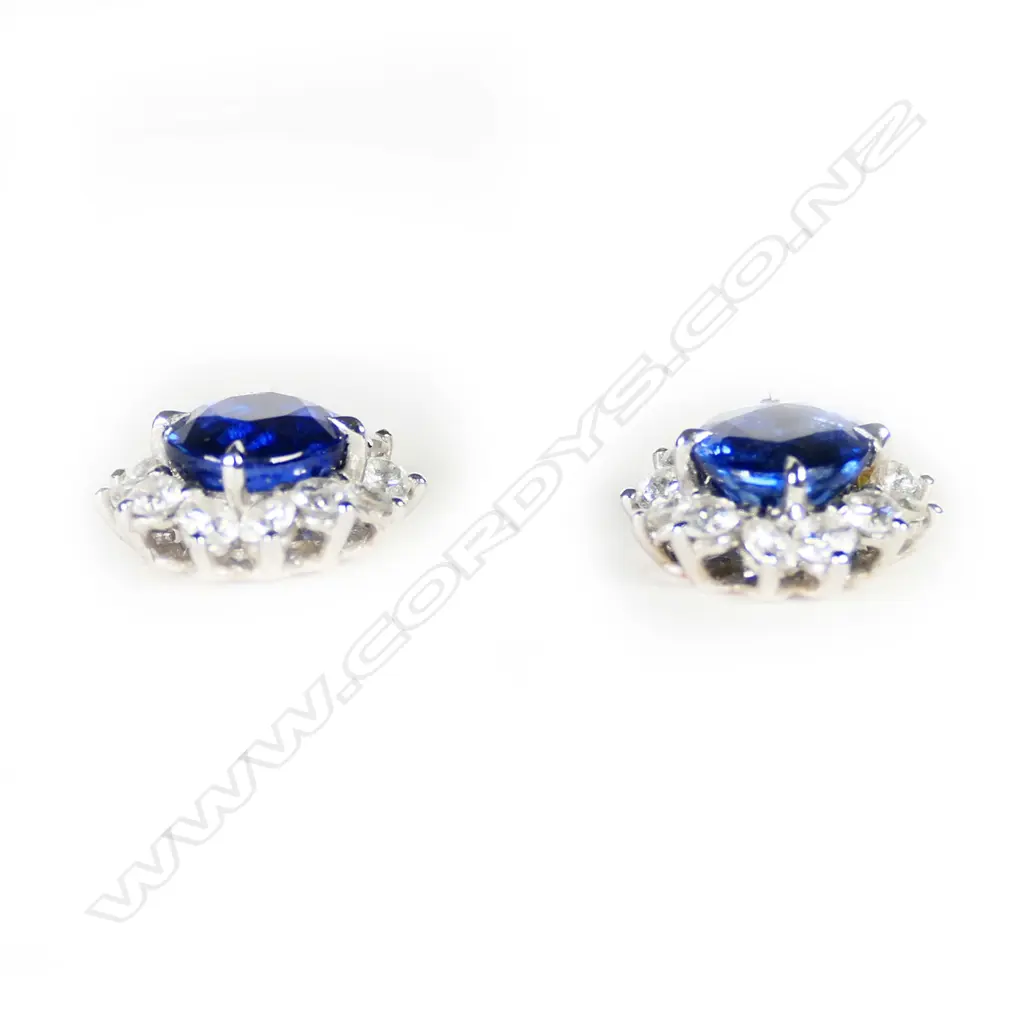 A pair of 18ct white gold sapphire and diamond stud earrings, Image 1++