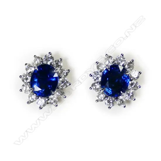 A pair of 18ct white gold sapphire and diamond stud earrings,