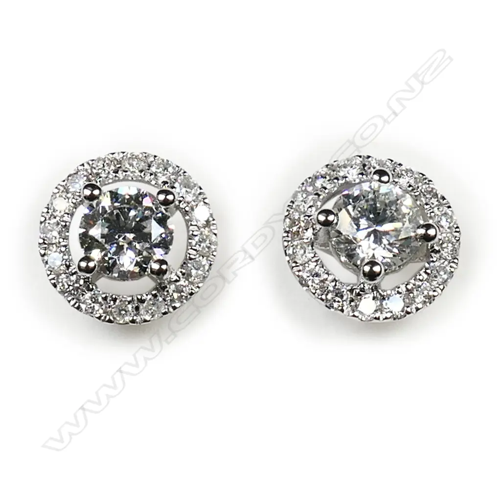 A pair of 18ct white gold and diamond cluster earrings, Image 1++
