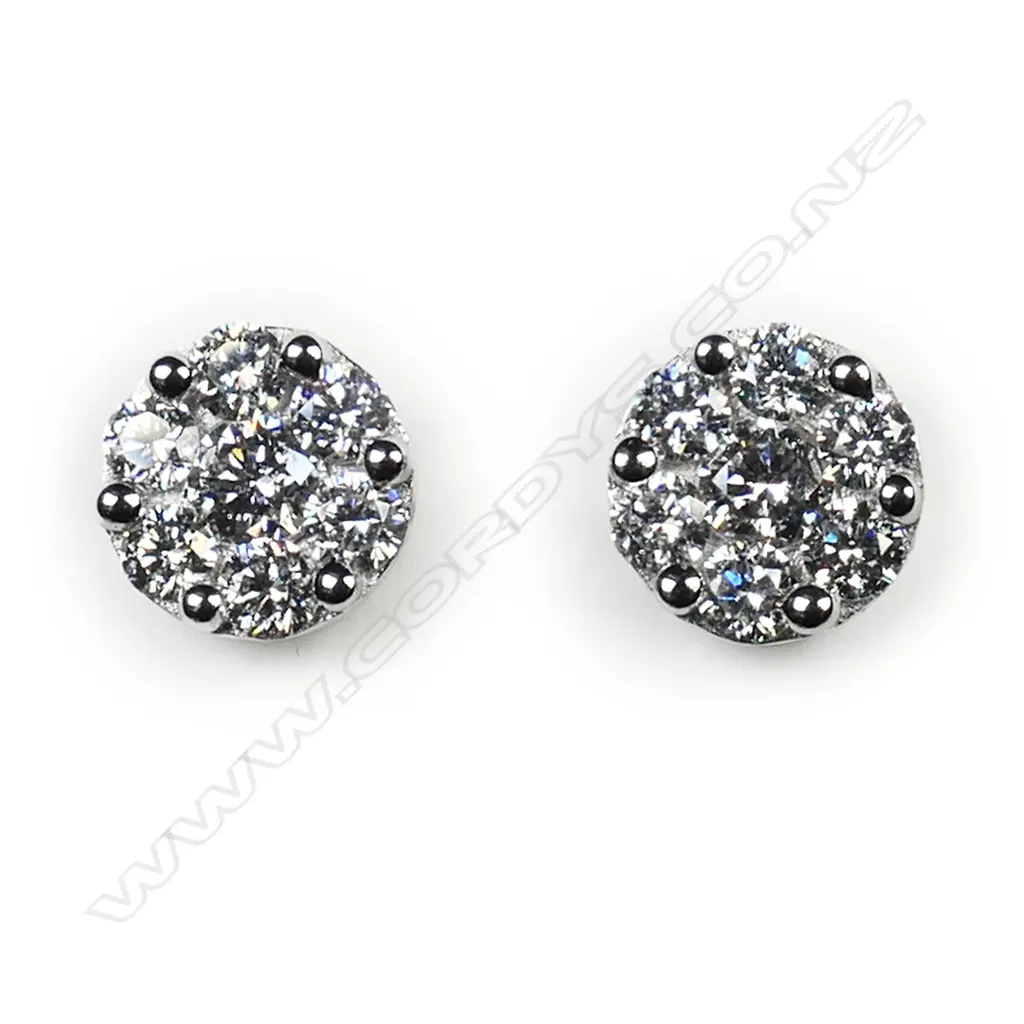 A pair of 18ct white gold and diamond cluster earrings, Image 1++