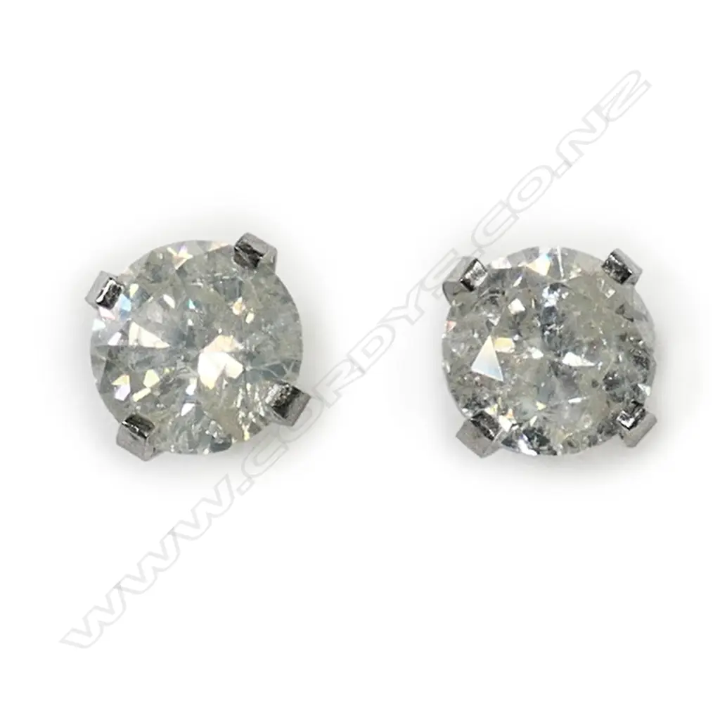 A pair of 14ct white gold and diamond stud earrings, Image 1++